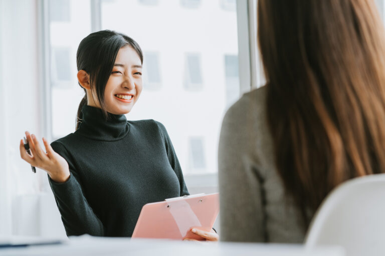 Happy interviewer asking culture fit interview questions