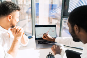 Two employees reviewing interview process data