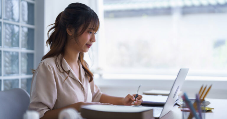 Young job applicant sitting at a computer taking a predictive candidate assessment test