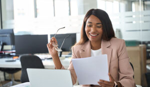 professional reviewing employee motivation assessments to improve employee retention